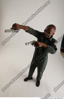 20 2018 01 ERIC STANDING POSE WITH GUNS